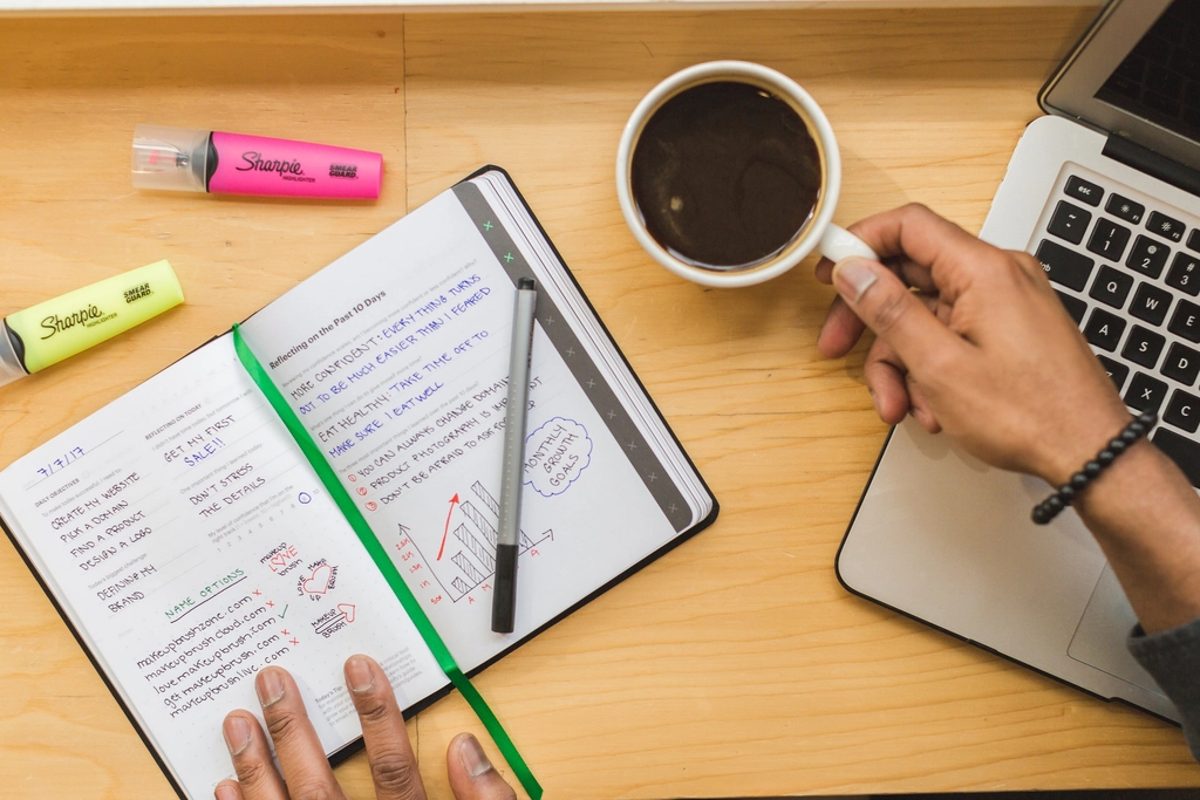 Planning notes and coffee on a desk